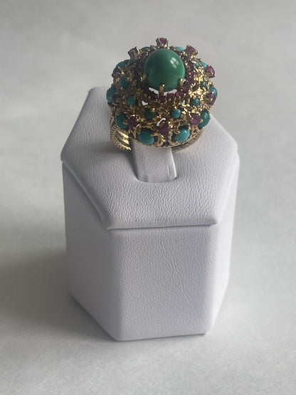 A vintage turquoise dome ring with rubies in a 14kt setting