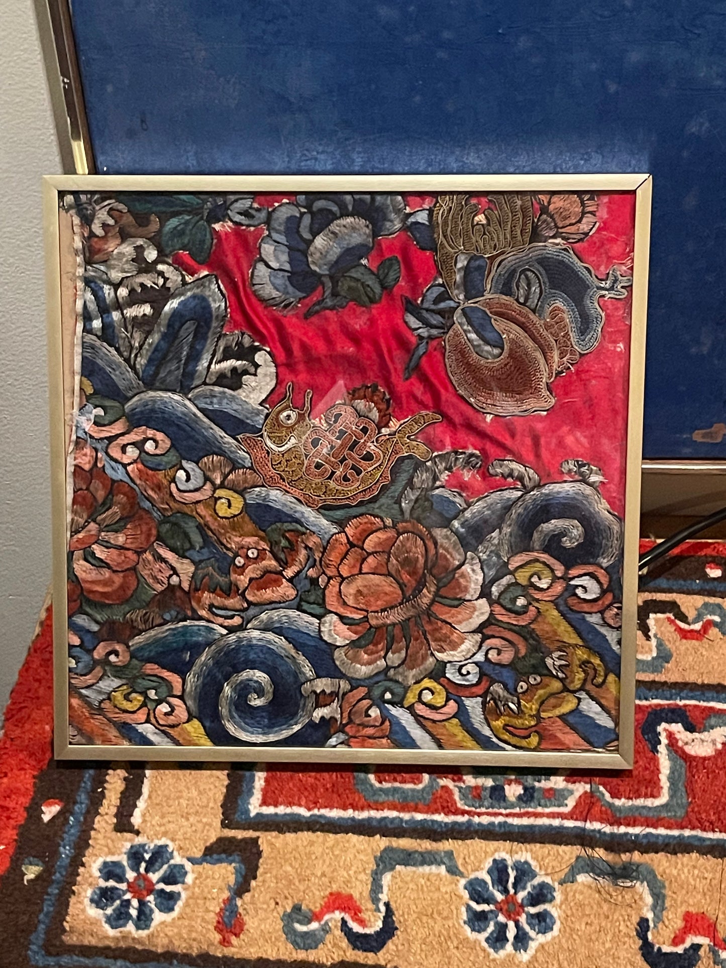 An antique framed Chinese embroidered textile fragment