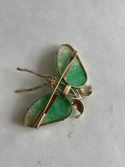 A vintage butterfly shaped brooch with jade and 14kt gold