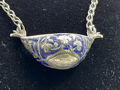 A vintage silver pendant and chain
