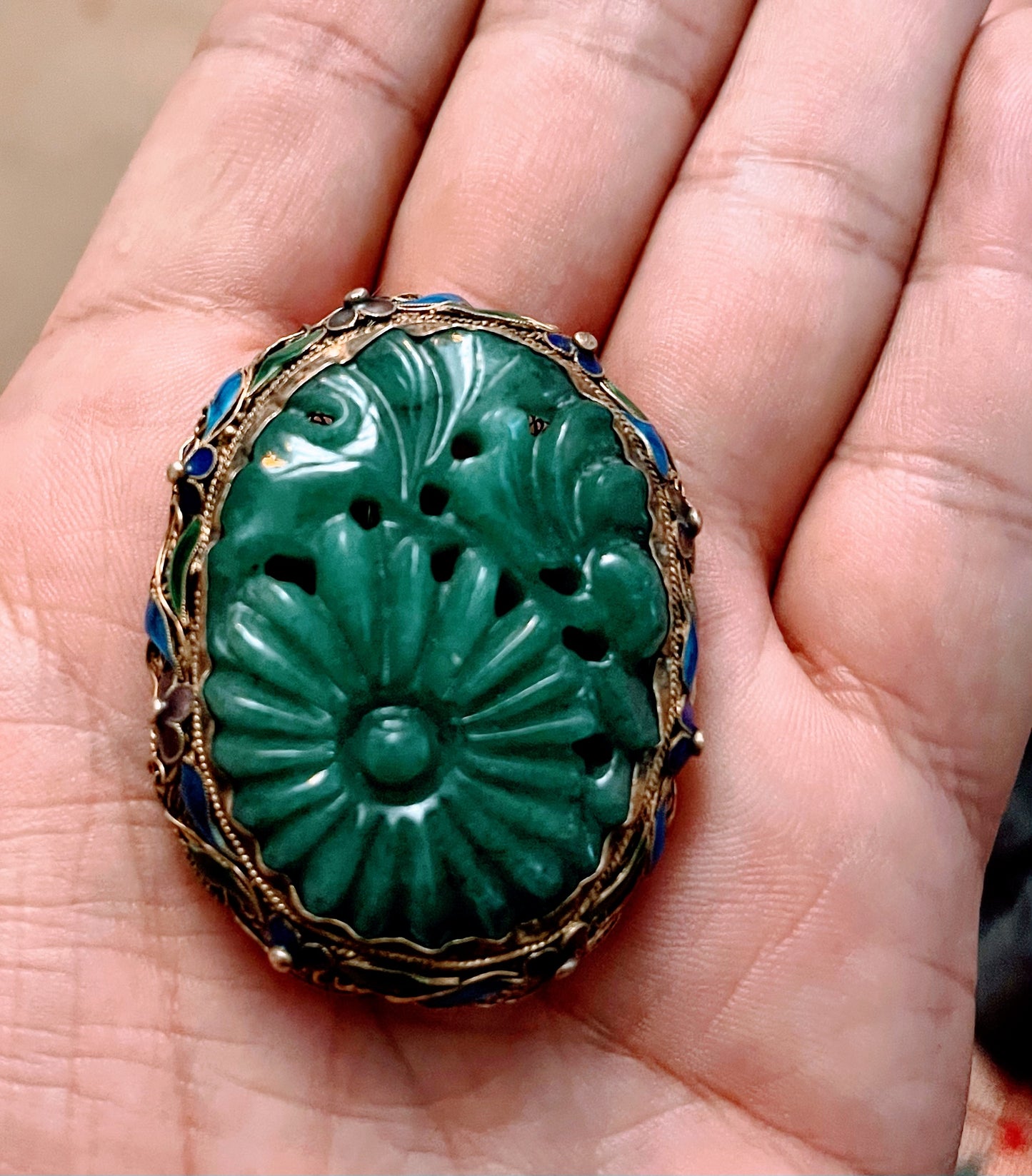 A vintage jade brooch in enameled gilt silver