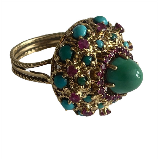 A vintage turquoise dome ring with rubies in a 14kt setting
