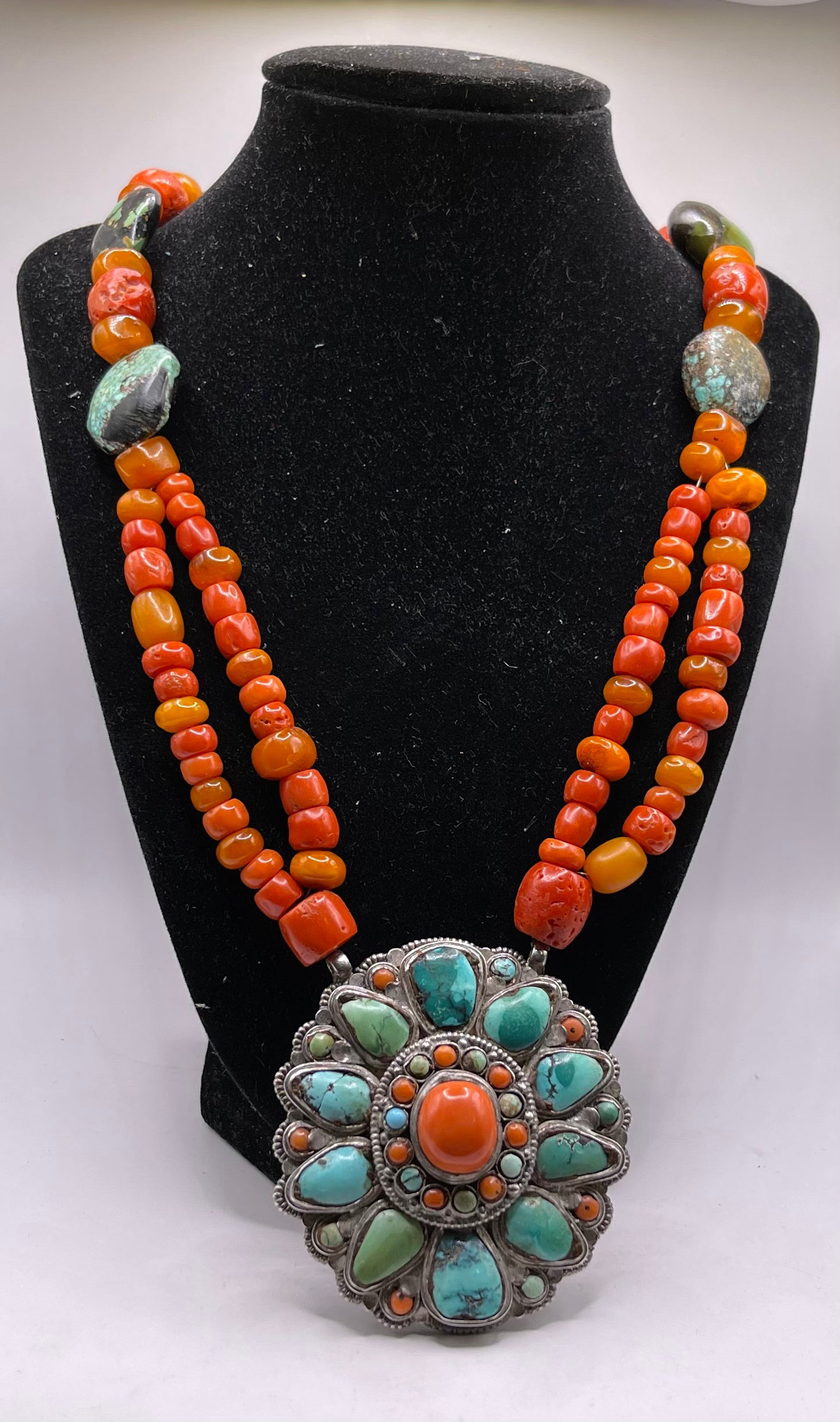 Coral, amber and turquoise necklace with a turquoise and coral silver pendant