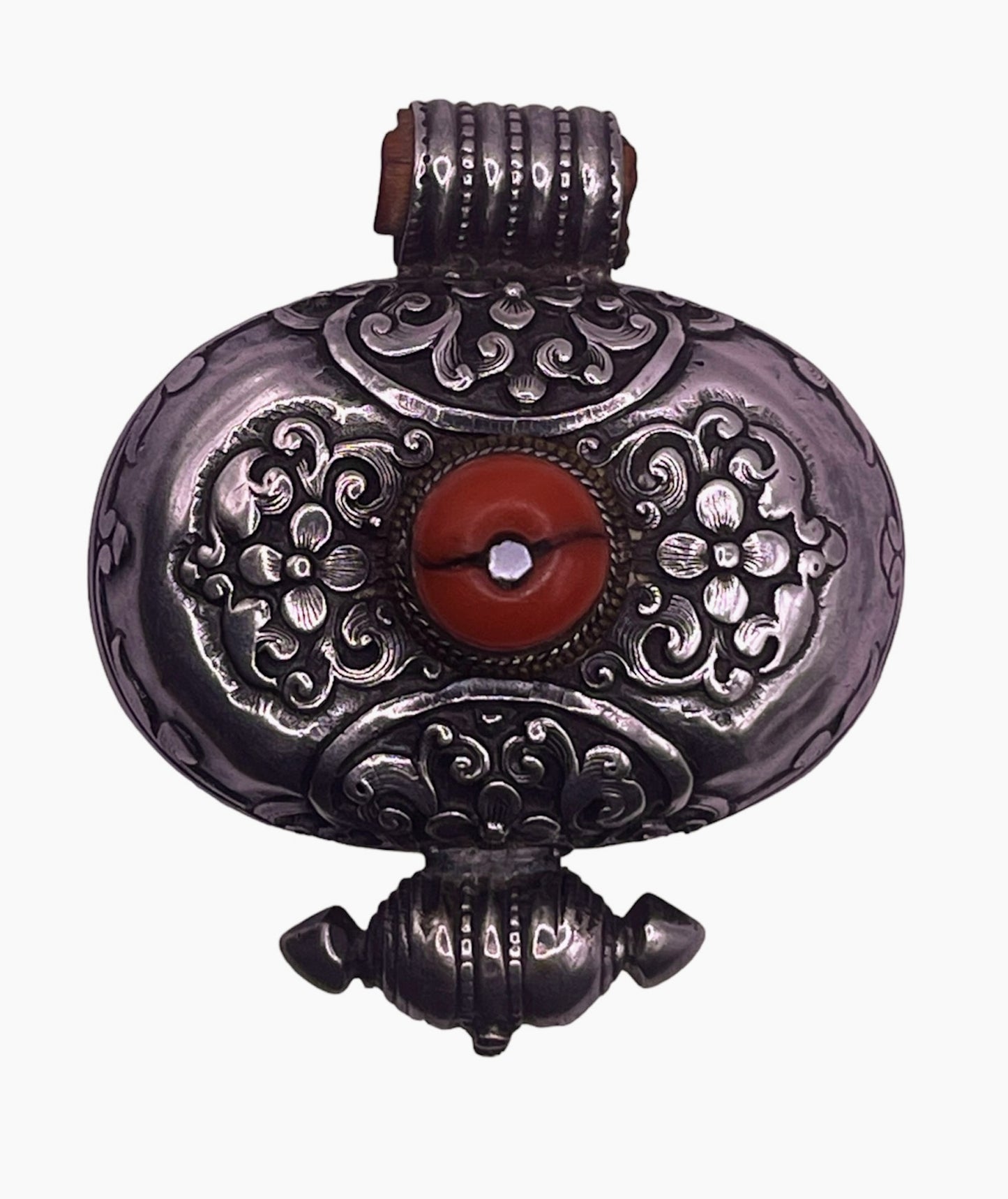 An antique silver and coral ghau amulet