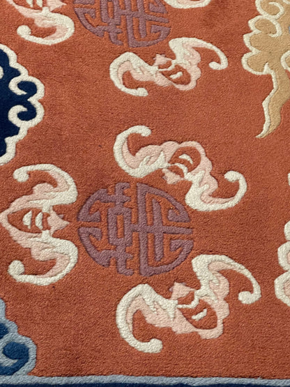 A mid 20th C. Peking rug with clouds and bats motifs