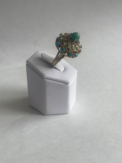 A vintage turquoise dome ring with rubies in a 14kt setting