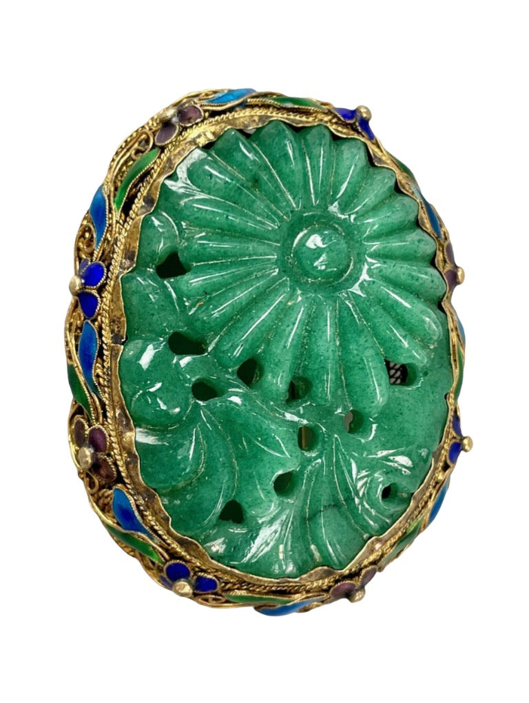 A vintage jade brooch in enameled gilt silver