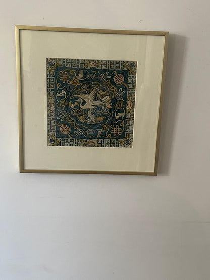 An antique framed Chinese embroidered textile fragment