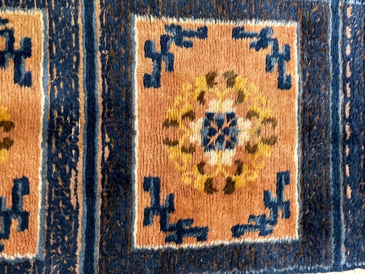 An antique triple seater Tibetan meditation rug