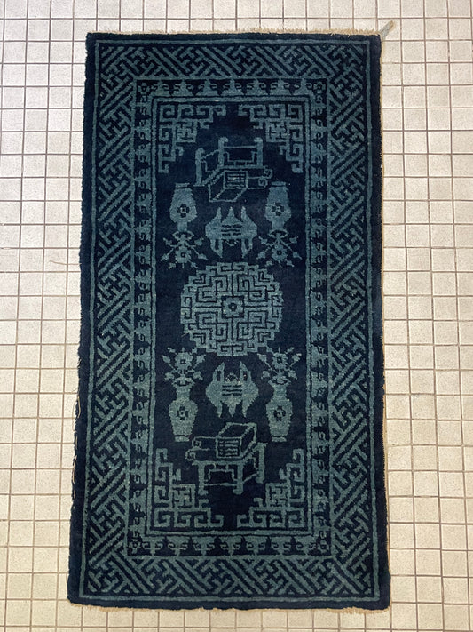 A vintage Baotao indigo rug