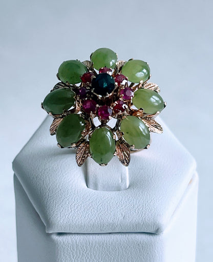 A vintage jade, ruby and sapphire cocktail ring
