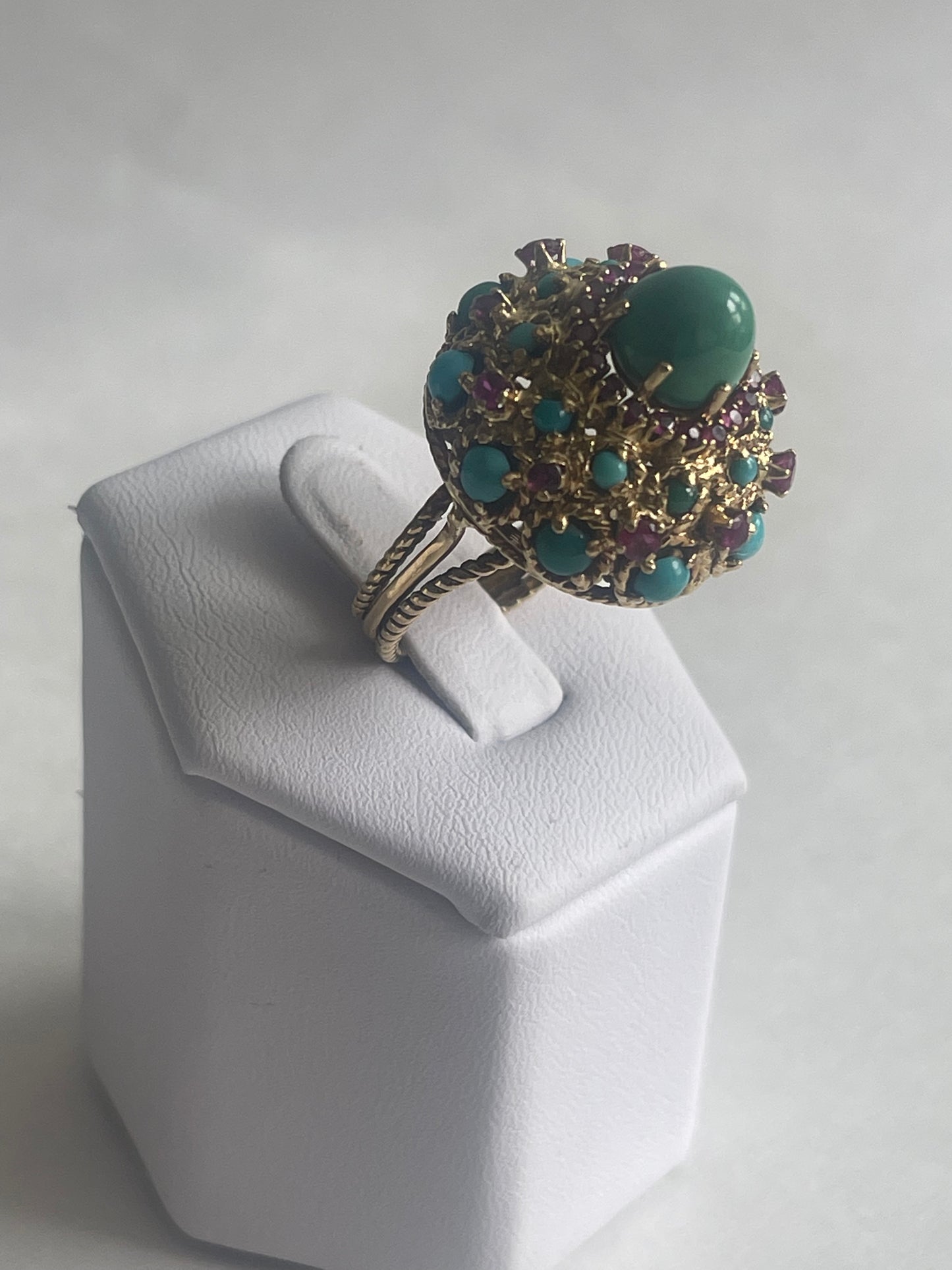 A vintage turquoise dome ring with rubies in a 14kt setting