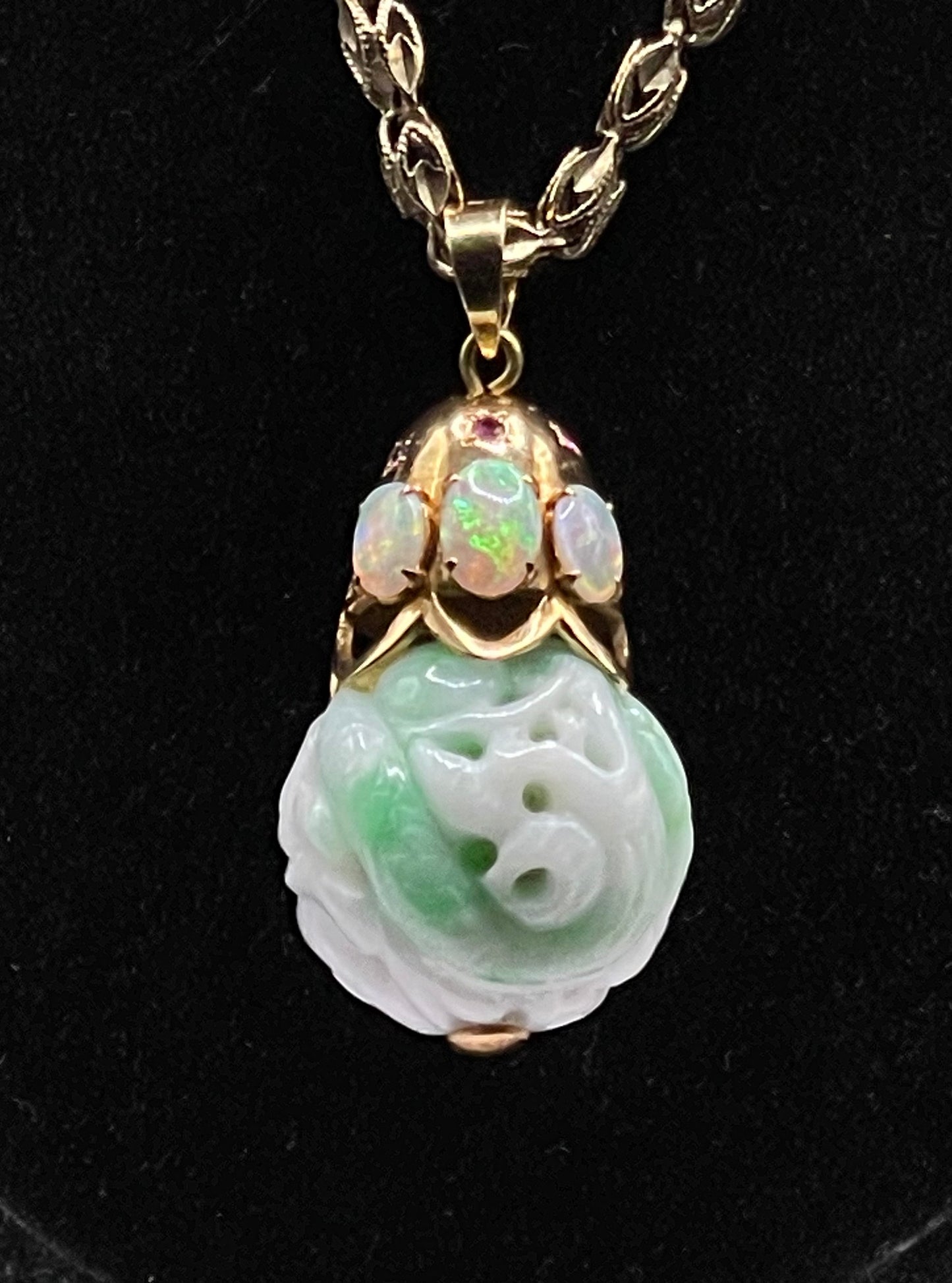 Carved shou jade bead pendant with opals and ruby