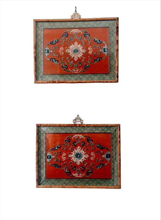 A pair of framed embroidered antique silk wall hangings