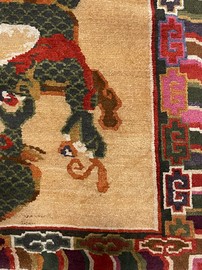 A vintage mid 20th c. Tibetan rug with dragons