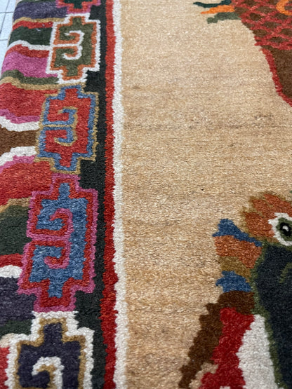 A vintage mid 20th c. Tibetan rug with dragons