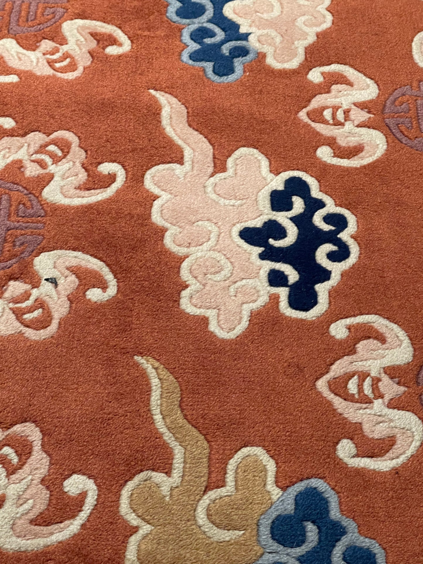 A mid 20th C. Peking rug with clouds and bats motifs