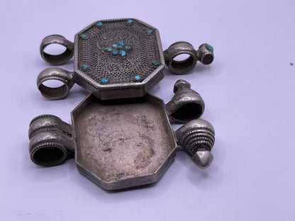 An antique 19th C., few Tibetan silver ghau with silver filigree and turquoise.