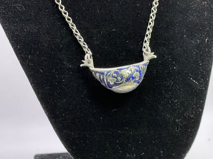 A vintage silver pendant and chain