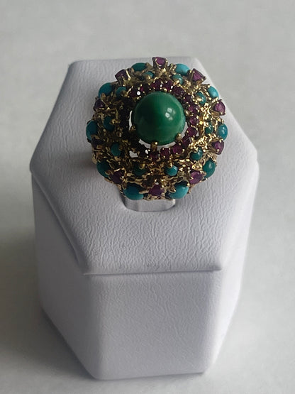 A vintage turquoise dome ring with rubies in a 14kt setting