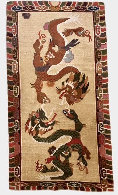 A vintage mid 20th c. Tibetan rug with dragons