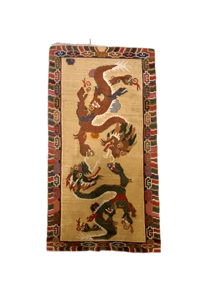 A vintage mid 20th c. Tibetan rug with dragons
