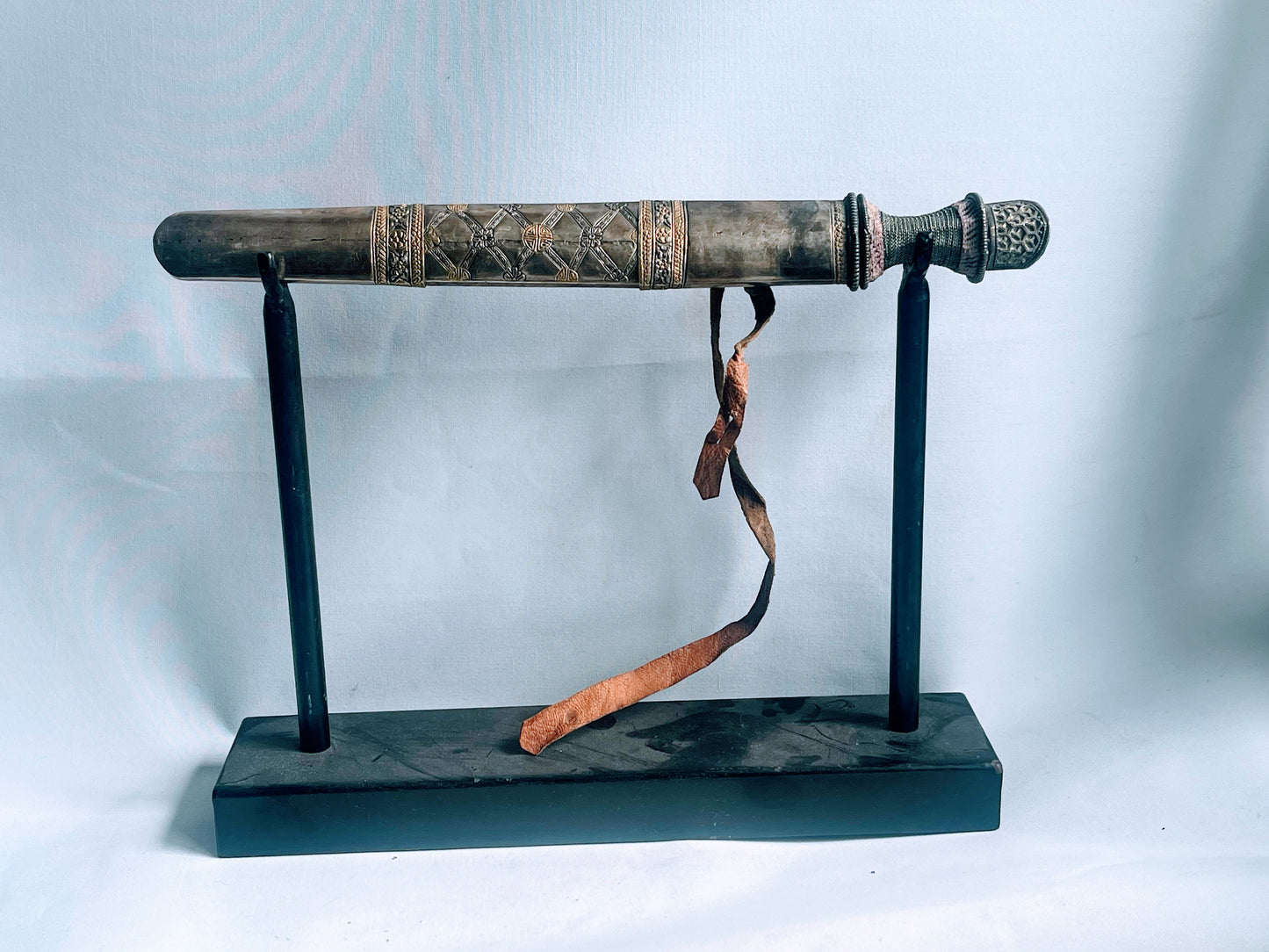 An antique Bhutanese dozum - dagger with a carved silver sheath