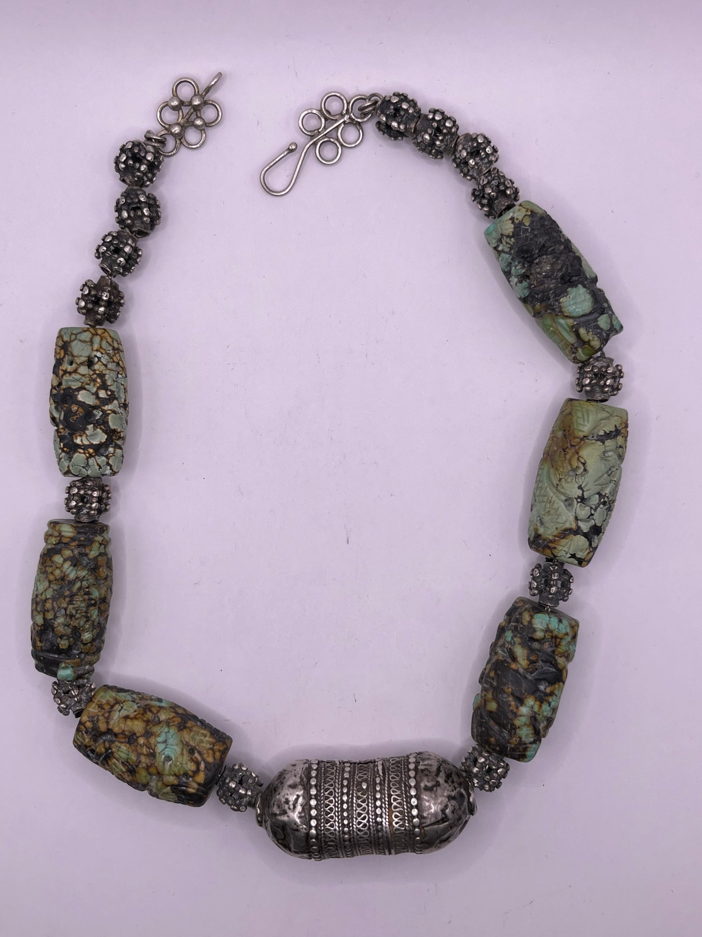 Vintage necklace with carved turquoise beads and antique silver beads