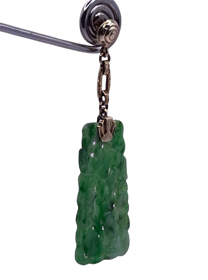 A vintage 1920s 14kt gold and dangling jade earring