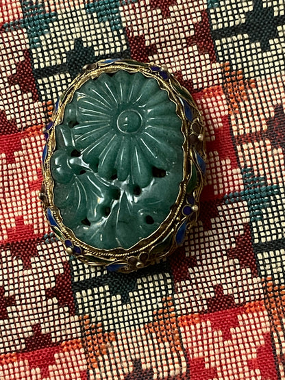 A vintage jade brooch in enameled gilt silver