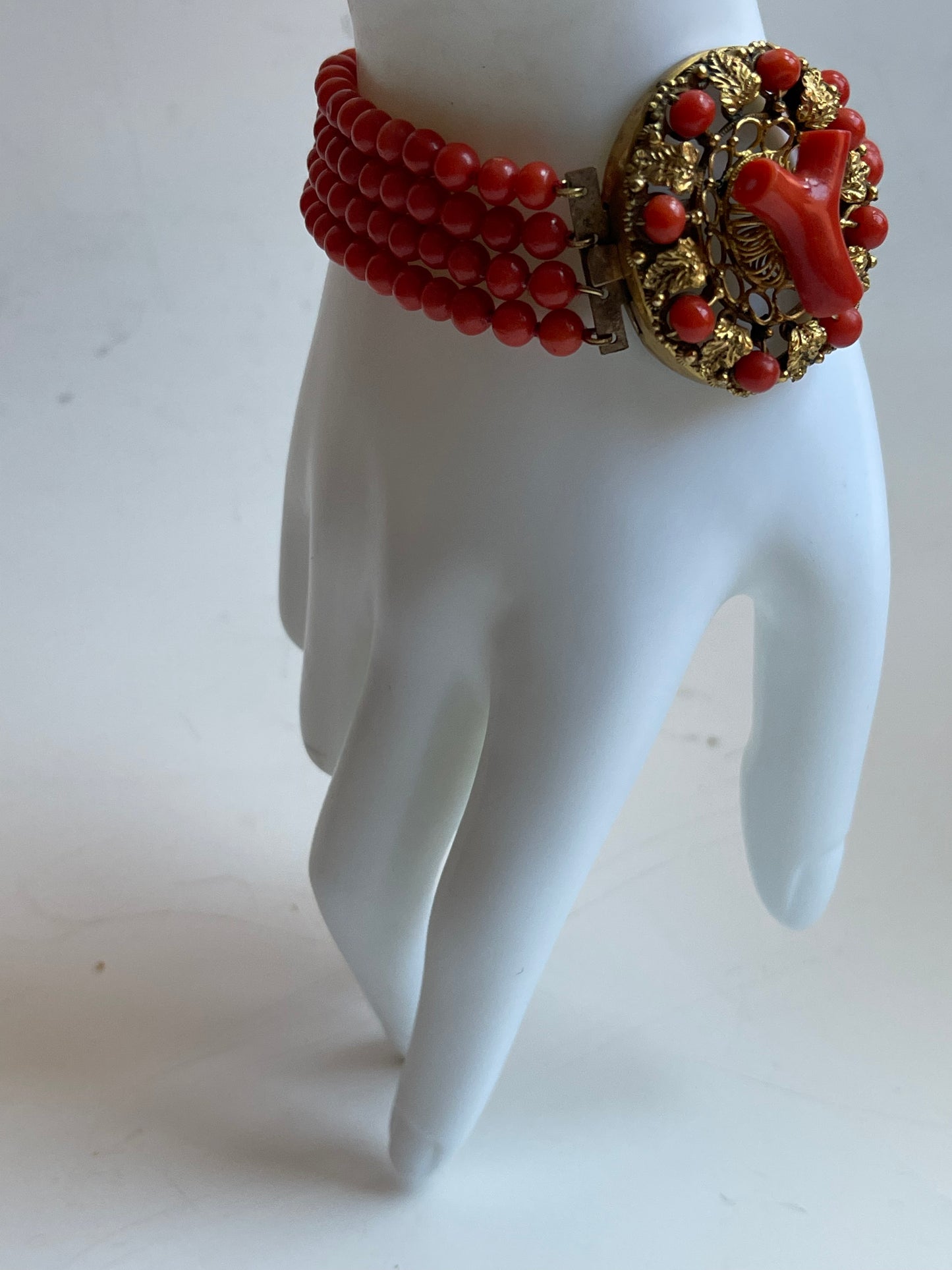 An antique coral bracelet with 4 strings of coral