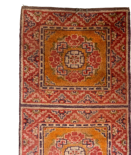 An antique triple seater Tibetan meditation rug
