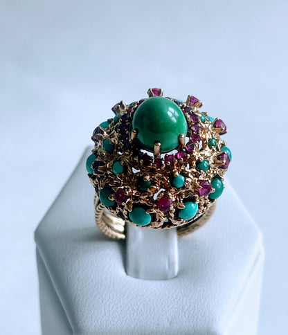 A vintage turquoise dome ring with rubies in a 14kt setting