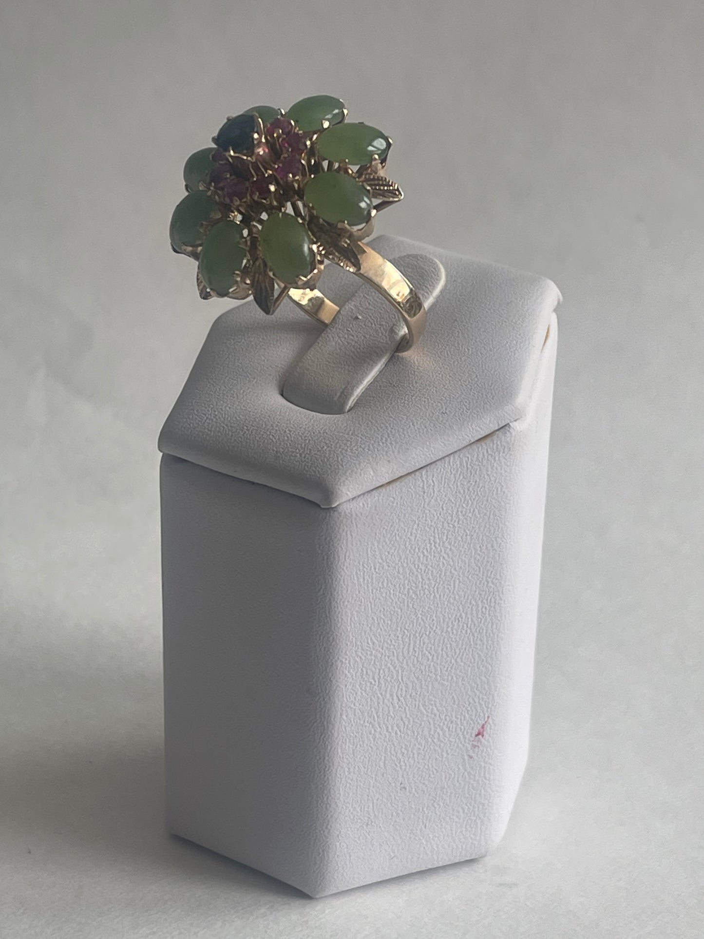 A vintage jade, ruby and sapphire cocktail ring