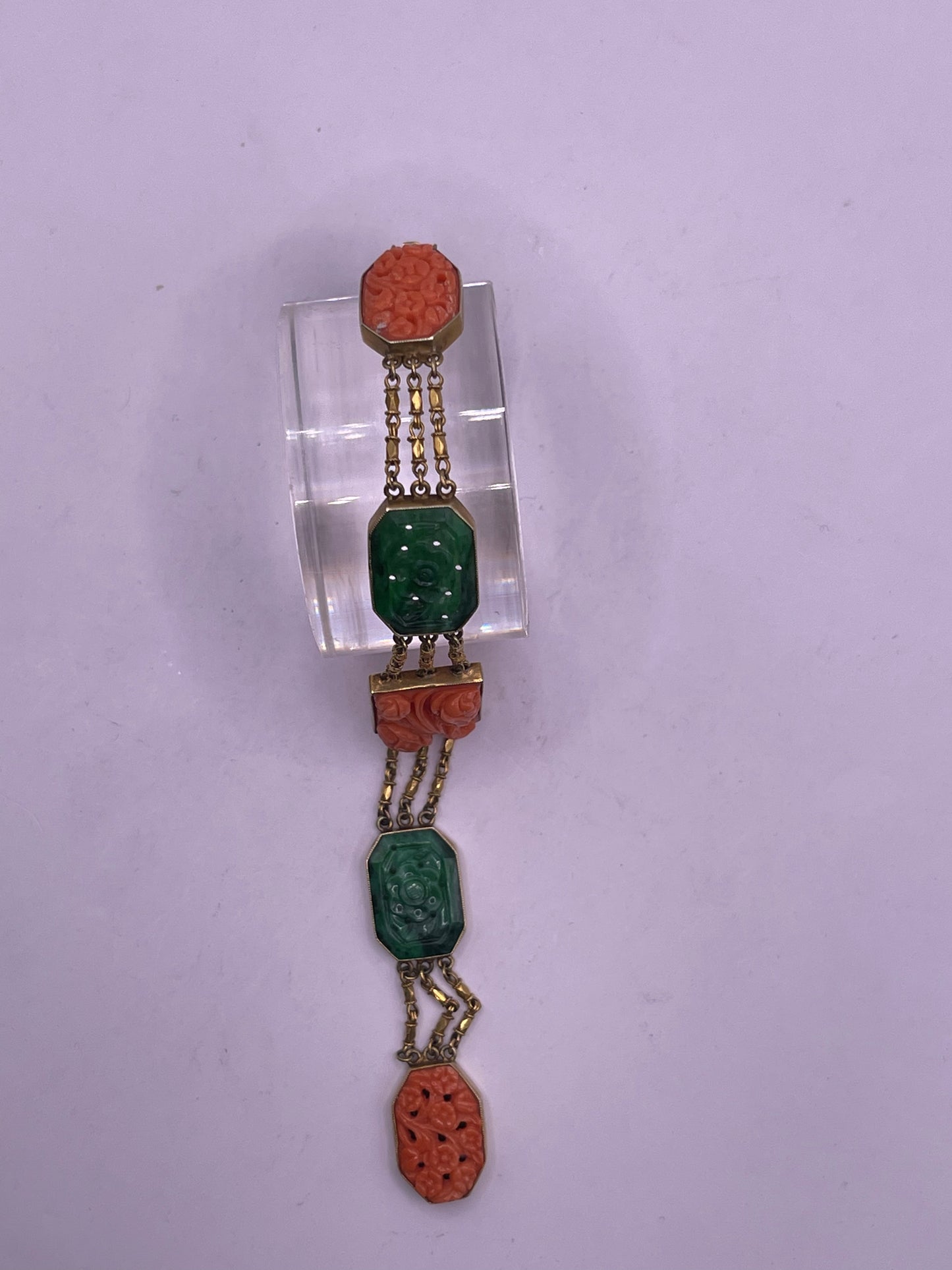 A jade and coral plaque in 14kt bracelet