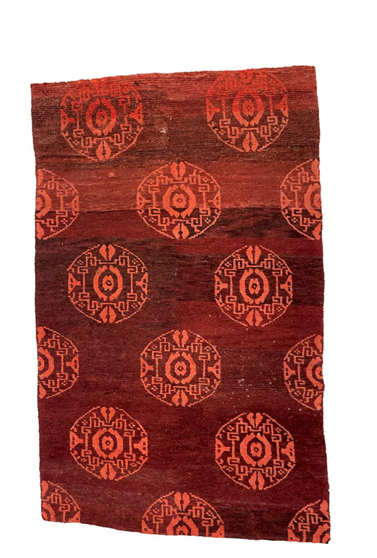 An antique Tibetan rug with coin motifs