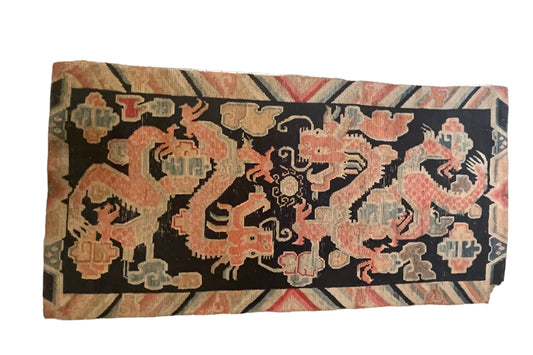 A 19th C., antique Tibetan dragon rug
