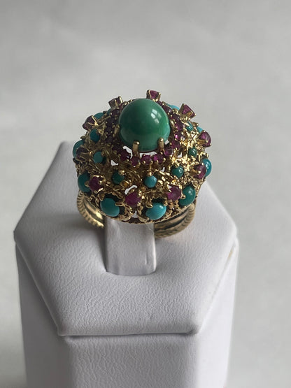 A vintage turquoise dome ring with rubies in a 14kt setting