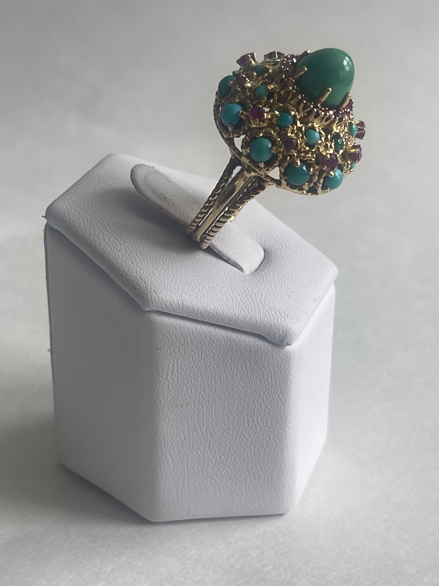A vintage turquoise dome ring with rubies in a 14kt setting