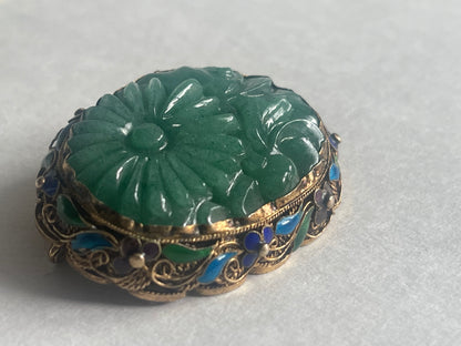 A vintage jade brooch in enameled gilt silver