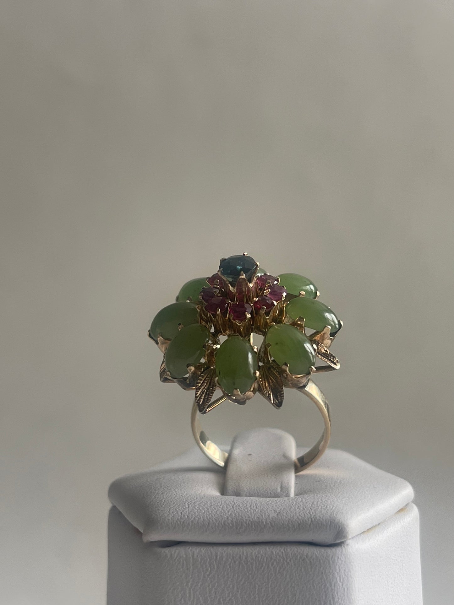A vintage jade, ruby and sapphire cocktail ring