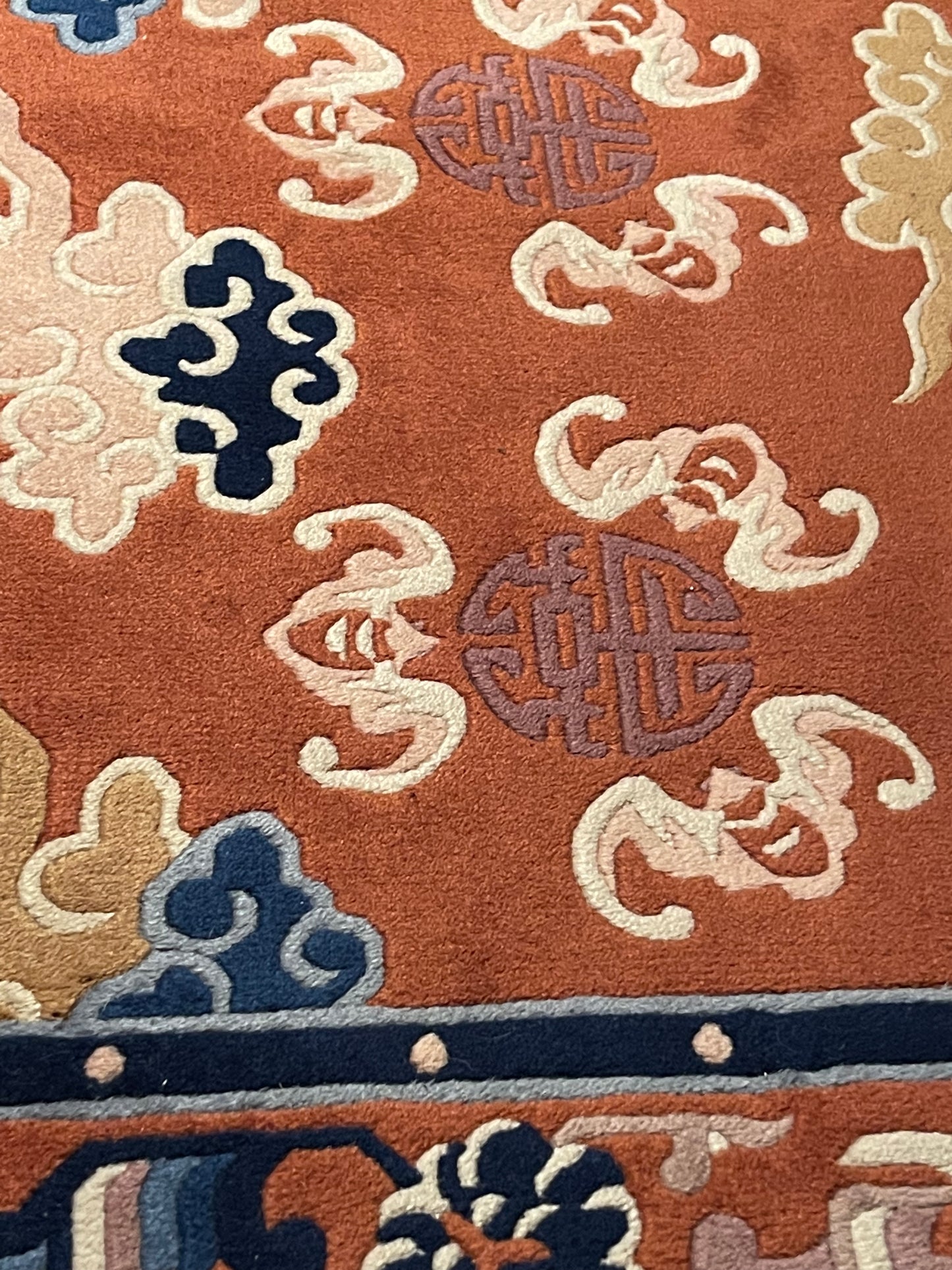 A mid 20th C. Peking rug with clouds and bats motifs