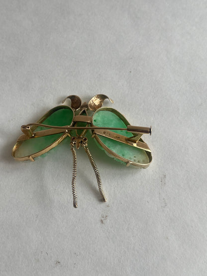 A vintage butterfly shaped brooch with jade and 14kt gold