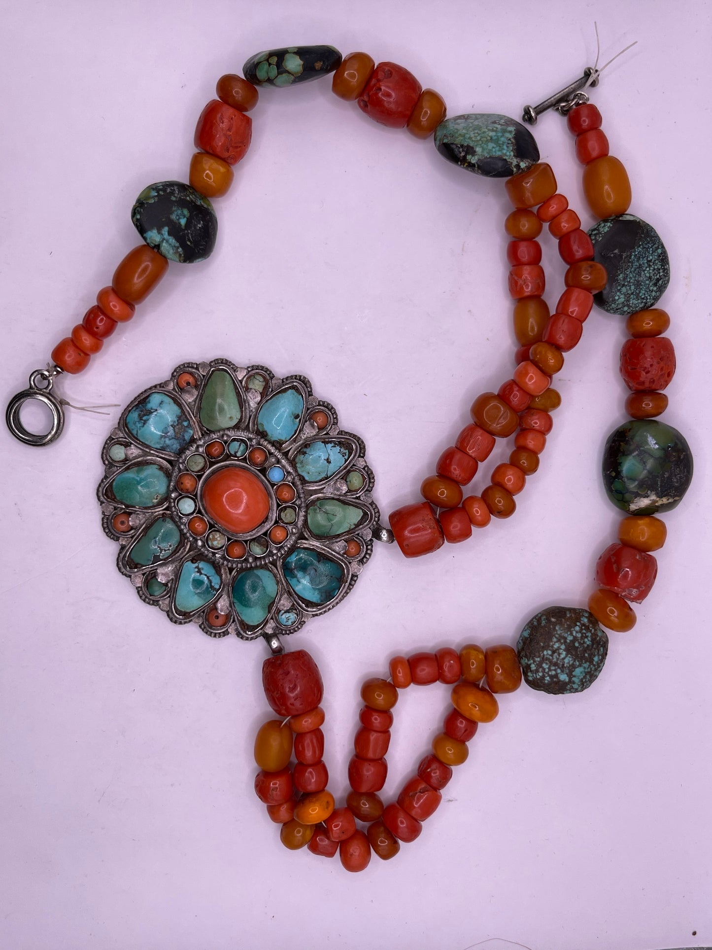 Coral, amber and turquoise necklace with a turquoise and coral silver pendant
