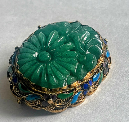 A vintage jade brooch in enameled gilt silver