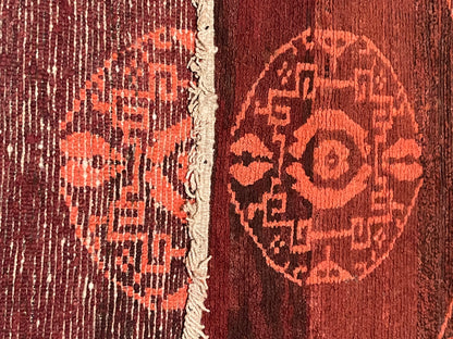 An antique Tibetan rug with coin motifs
